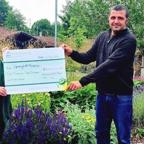 Paul with a cheque for Springhill Hospice